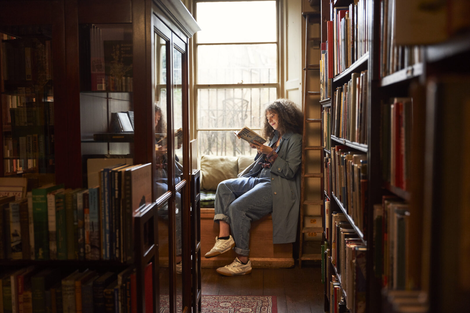 Woman reading in Macnaugton's Bookshop