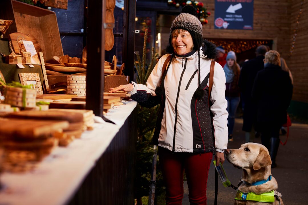 Lady with guide dog at Edinburgh Christmas market