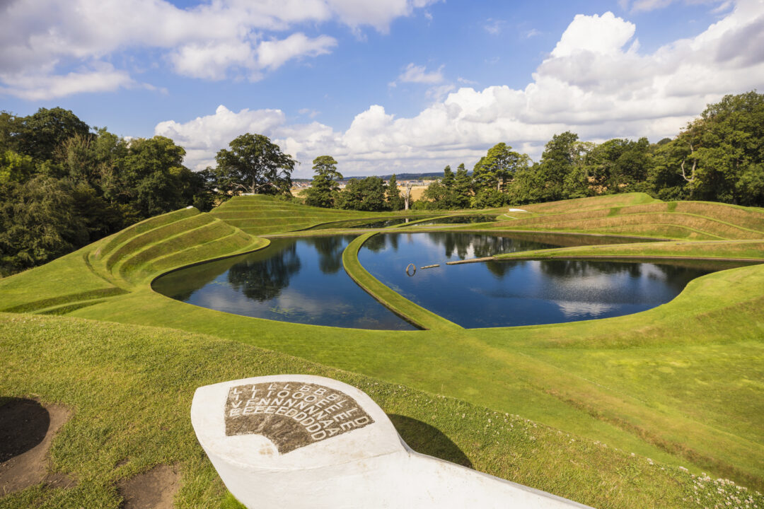 Large Earth Sculpture called Cells of Life whish features land sculptured into hills with water ponds at Jupiter Artland