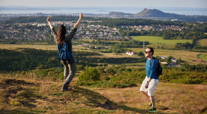 Couple on Pentland Hills with Edinburgh City in Back ground