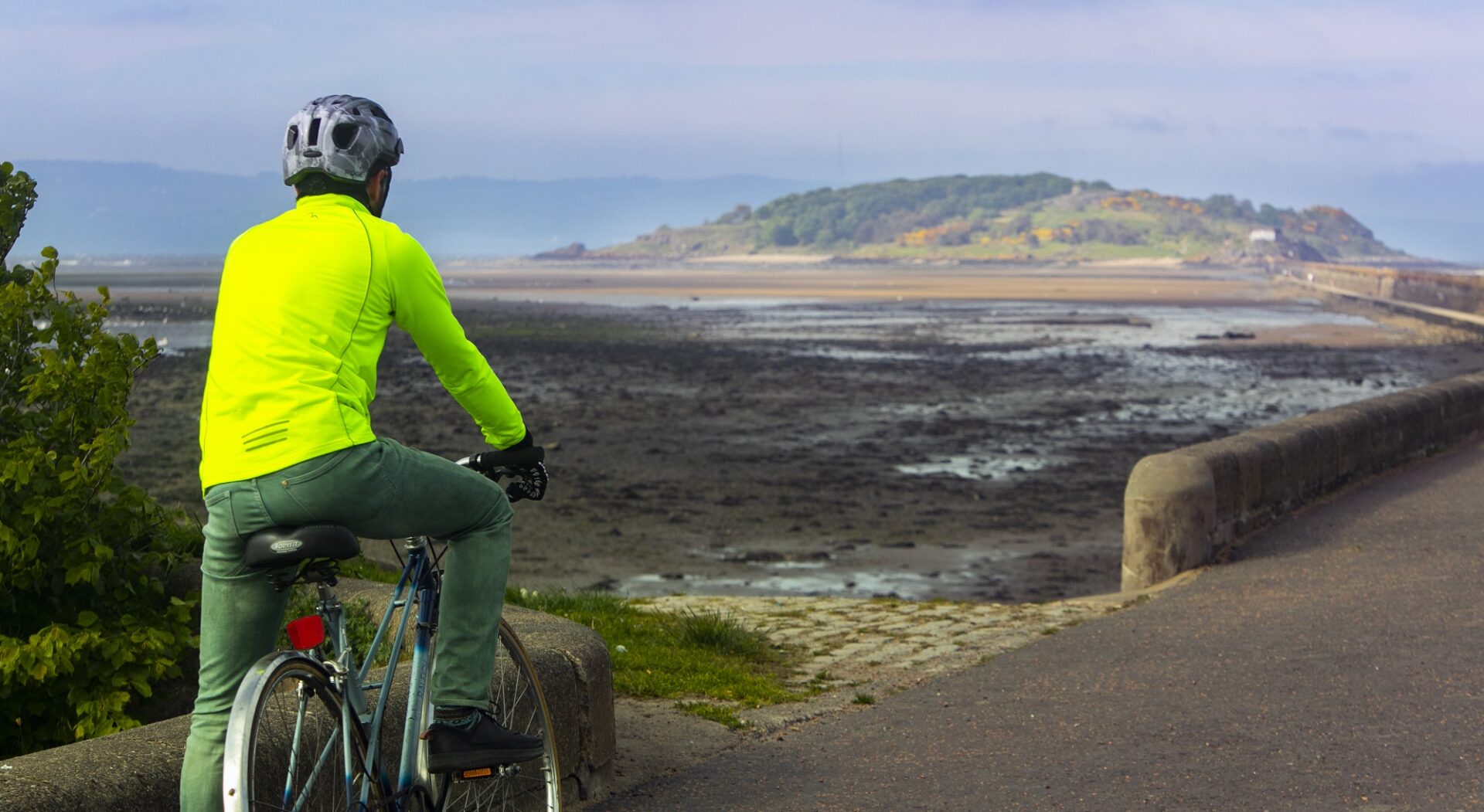 Person on bike looking at Cramond Island,