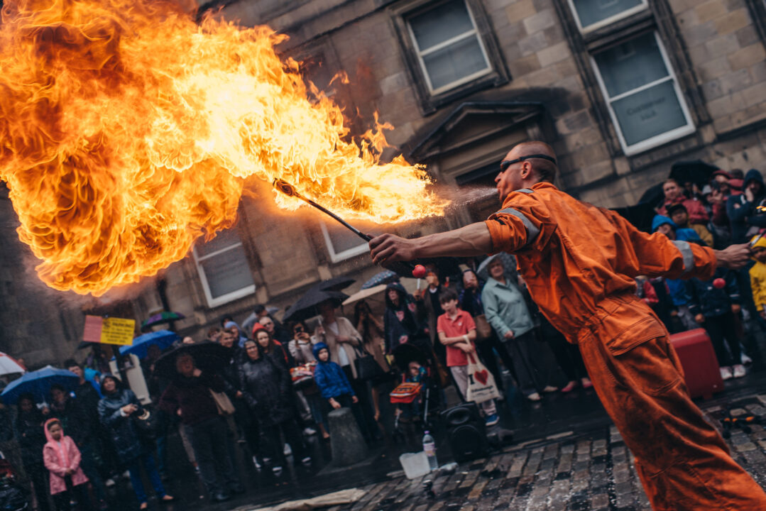 Fire breather performs on the Royal Mile during the Edinburgh Festival Fringe