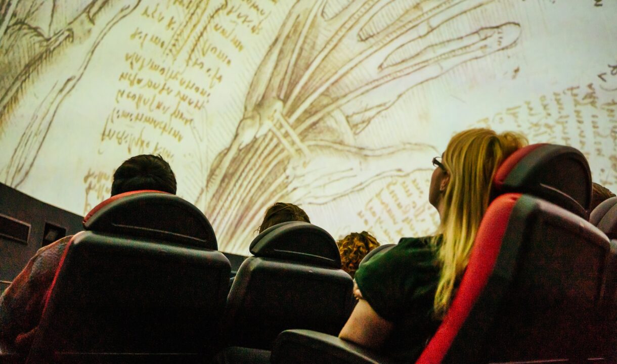 Lady watching Biomimcry programme on the planetarium screen at Dynamic Earth