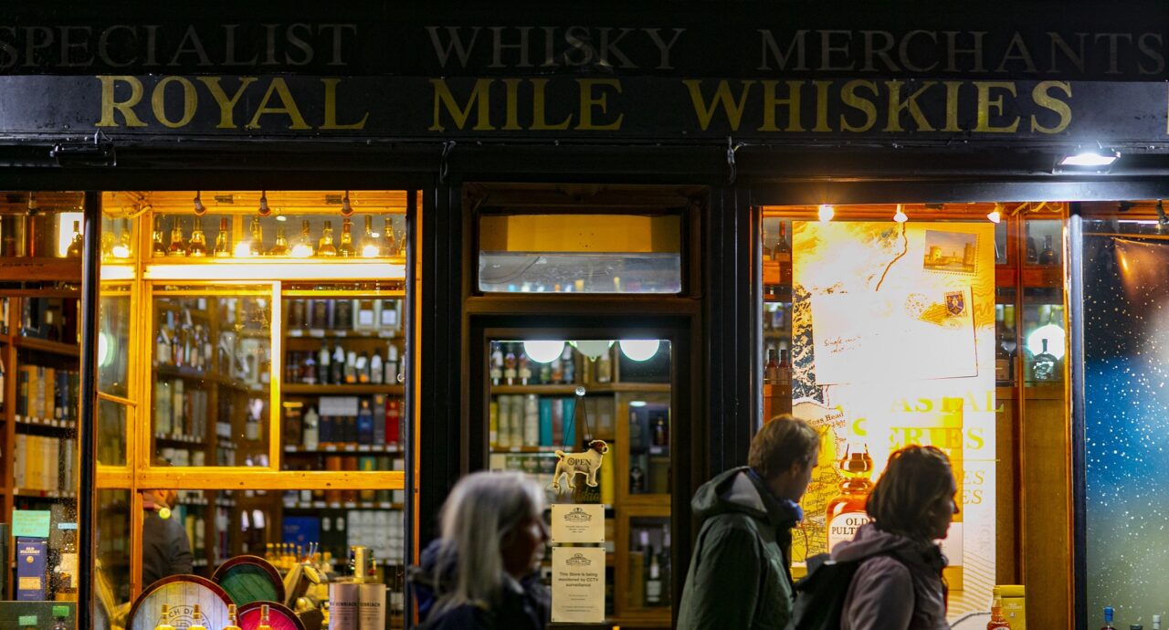Royal Mile Whiskies shop front at night