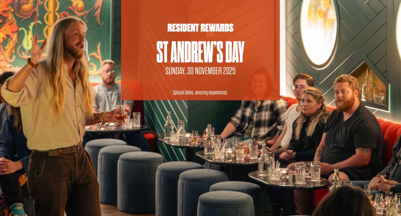 Orange box with words saying Rsidetn Reward Days St Andrews Day. Image behind is of tour guide doing whisky tasting with tour group.