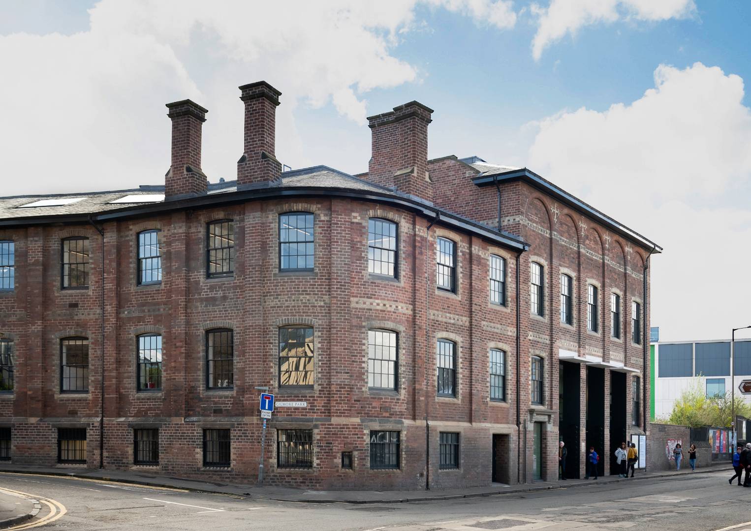 Image of the outside of the red brick corner building of the Printmakers