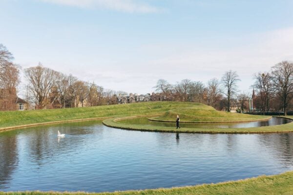 A woman walks on the landform sculpture at the Modern gallery