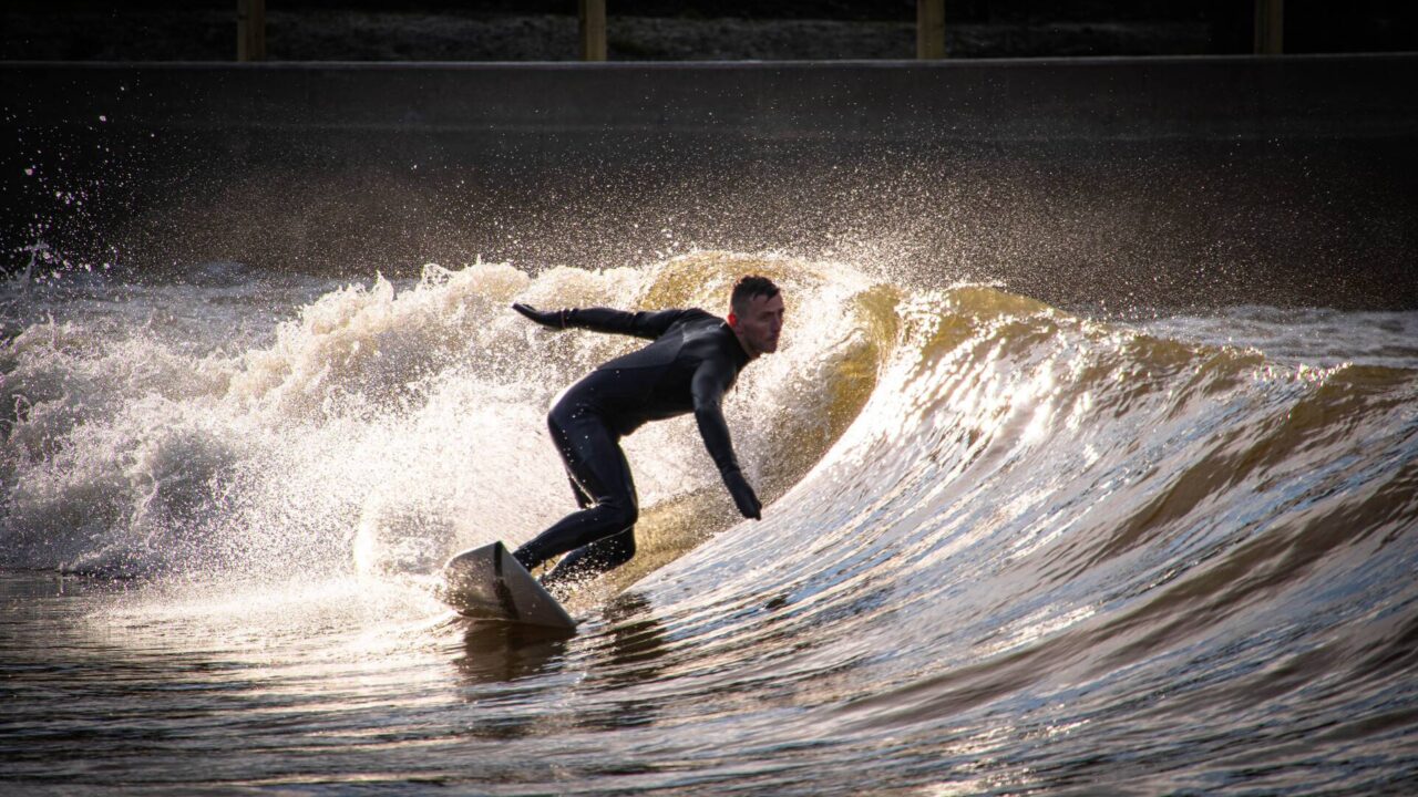 surfer riding a wave,© Lost Shore Surf Resort