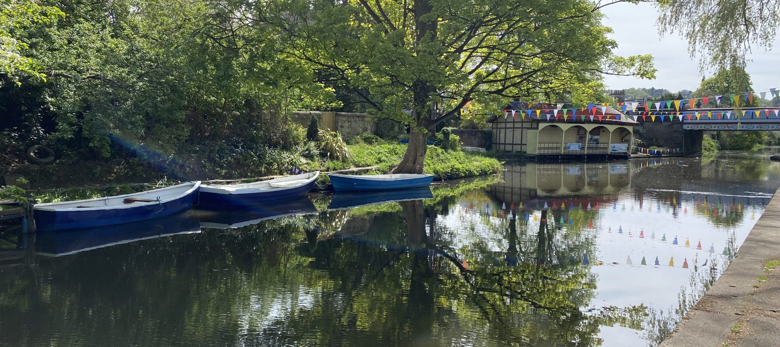 Boats tied up near boat house on the Union Canal.