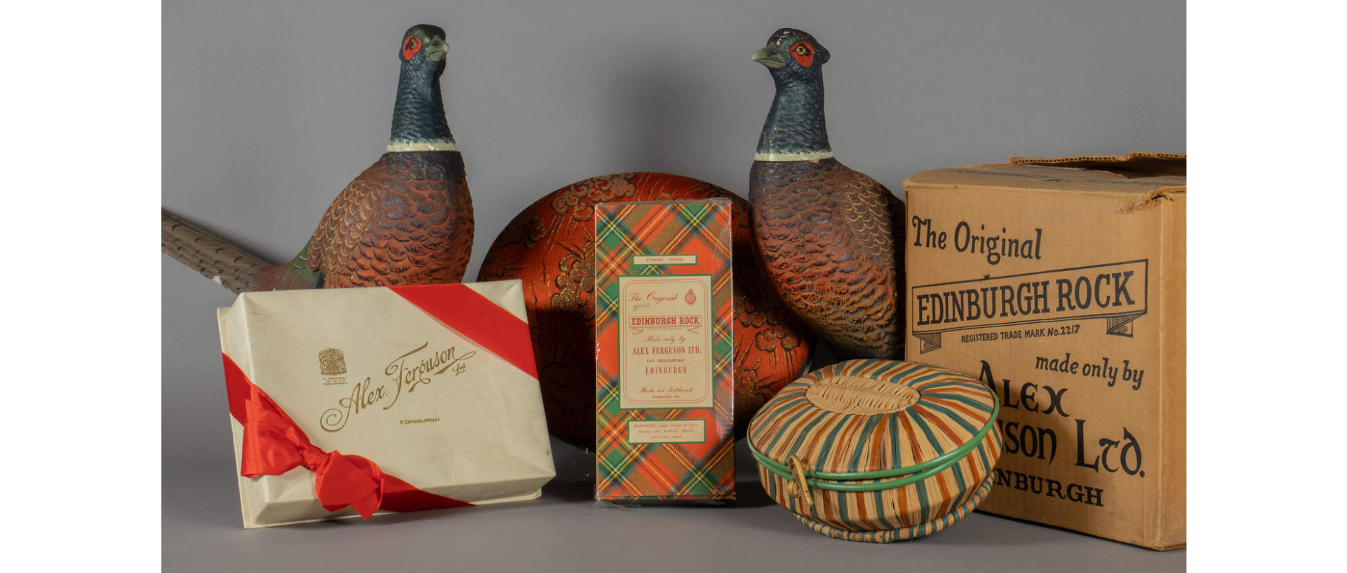 Two ornamental grouse and a selection of boxes of Alex Ferguson Edinburgh rock