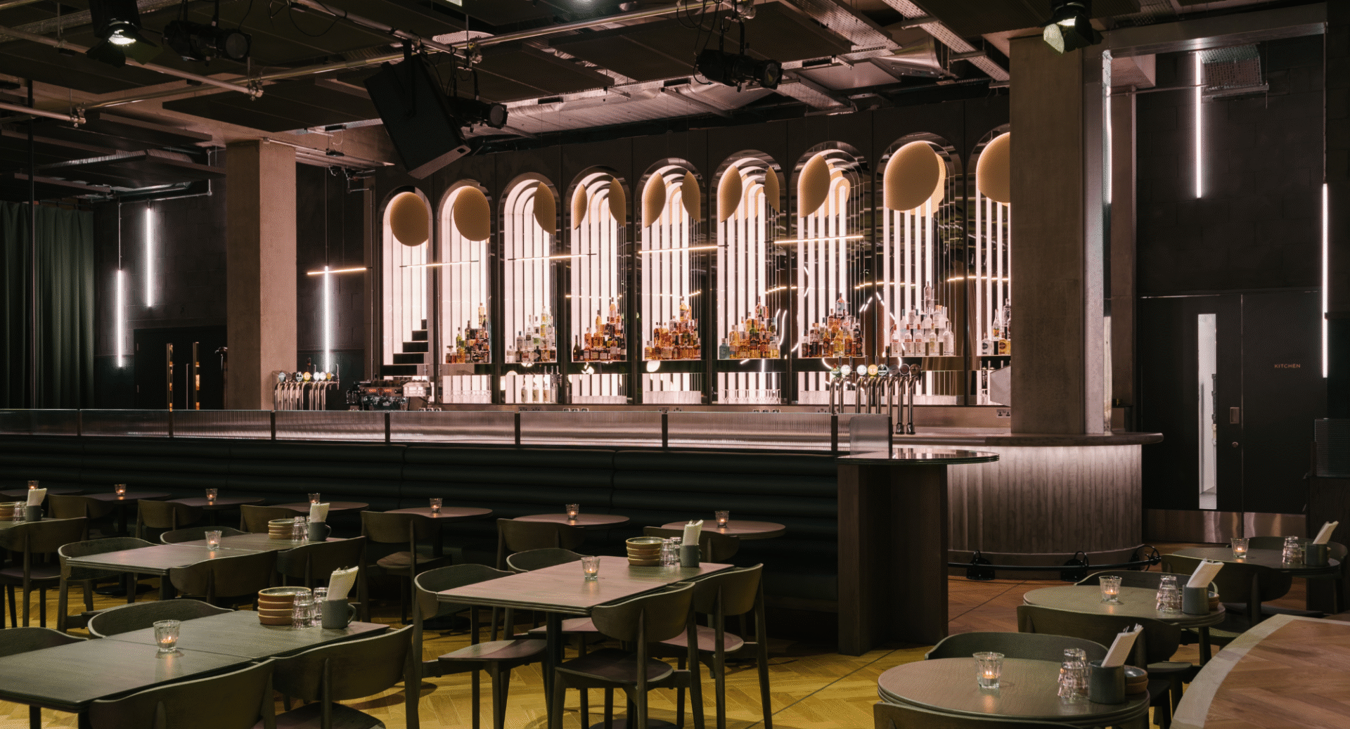 Interior of restaurant, with tables and chairs.